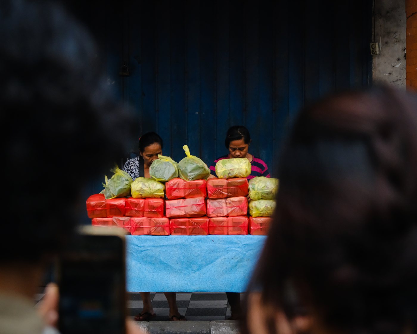 A market stall stacked with goods
