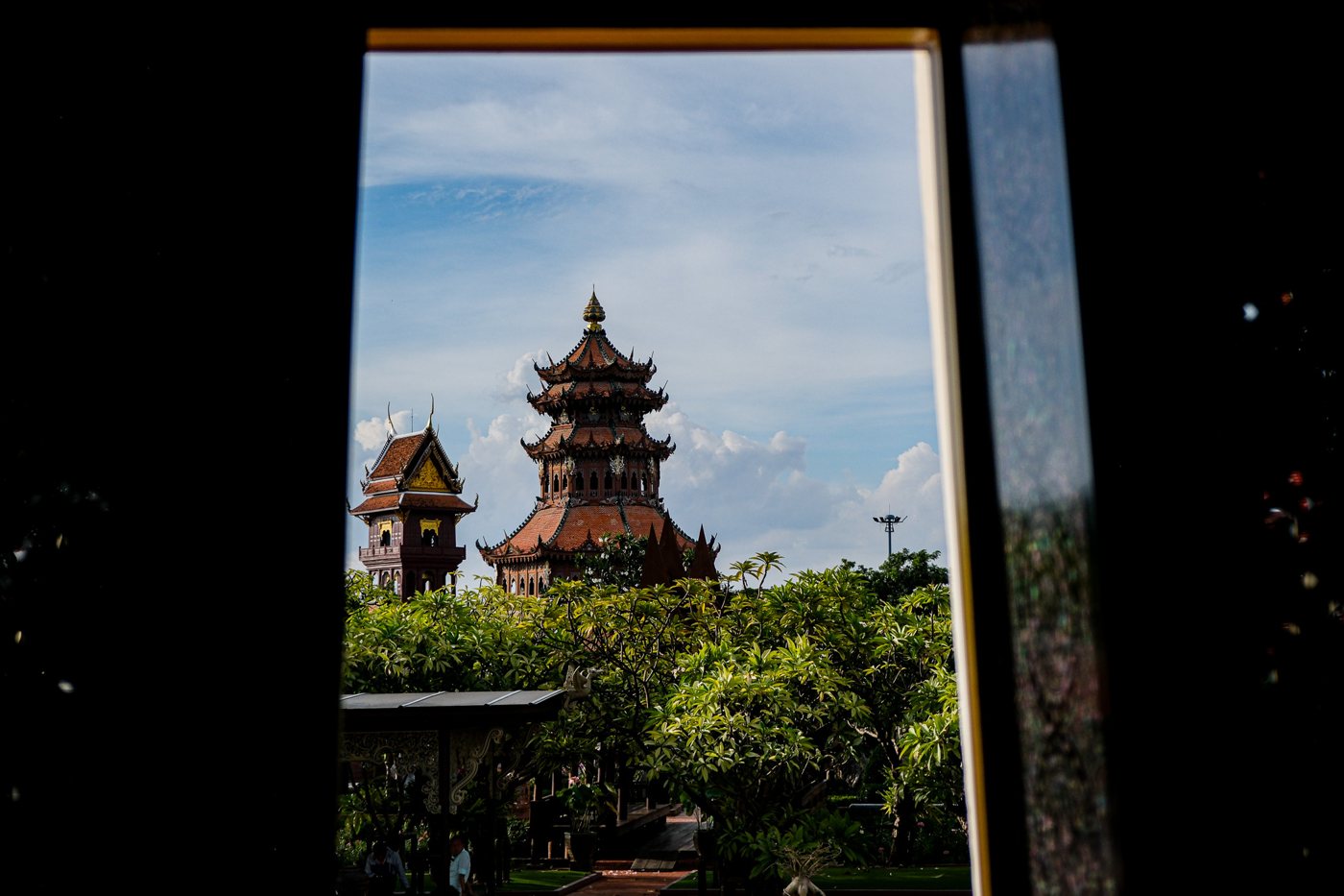A pagoda framed by a dark doorway