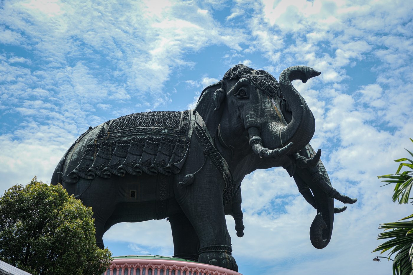 A giant elephant statue against a blue sky